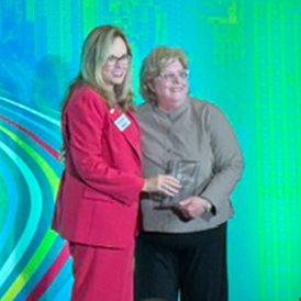 Maria Diamond (R) accepts the 2026 Leonard M. Ring Champion of Justice Award.
